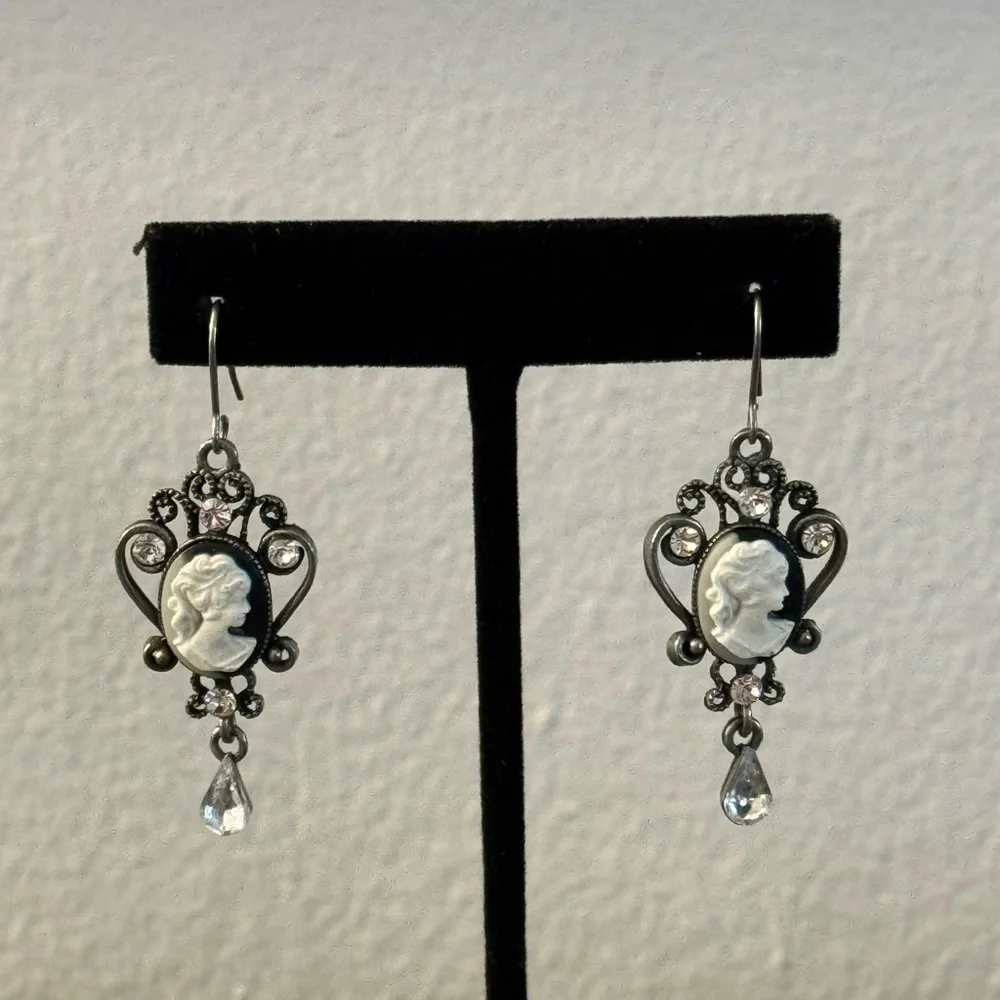 Silver tone cameo drop earrings with rhinestones
